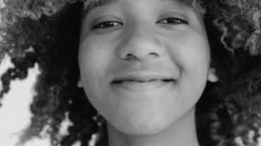 image of young woman smiling a the camera