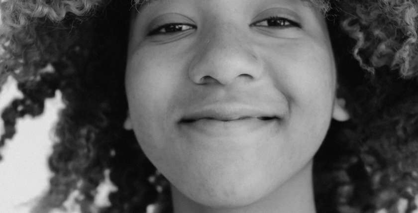 image of young woman smiling a the camera